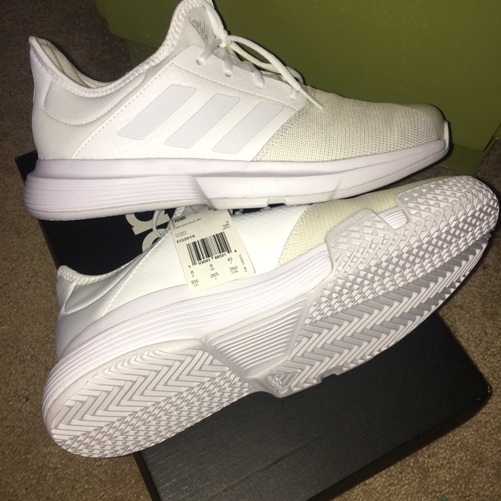 Adidas gamecourt white tennis shoes.
